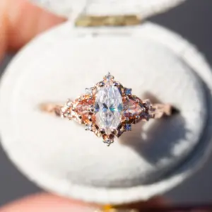 briar rose three stone with marquise moissanite and pink sapphire
