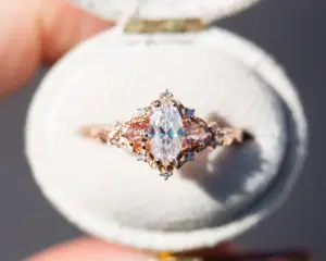 briar rose three stone with marquise moissanite and pink sapphire