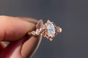 briar rose three stone with marquise moissanite and pink sapphire