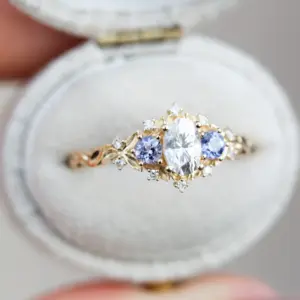briar rose three stone with oval moissanite and round tanzanite (fairy queen ring)