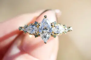 enchanted garden with .9ct marquise lab diamond and pear side stones