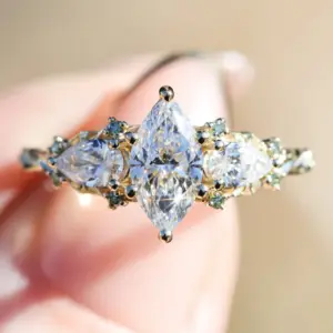 enchanted garden with .9ct marquise lab diamond and pear side stones