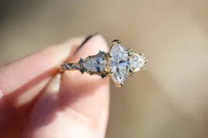 enchanted garden with .9ct marquise lab diamond and pear side stones