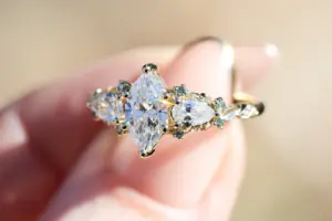enchanted garden with .9ct marquise lab diamond and pear side stones