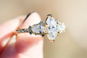 enchanted garden with .9ct marquise lab diamond and pear side stones