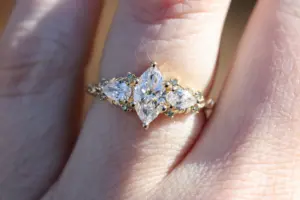 enchanted garden with .9ct marquise lab diamond and pear side stones