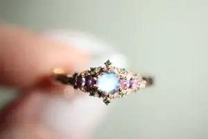 briar rose three stone with 5mm round moonstone and pink sapphire/green diamond accents