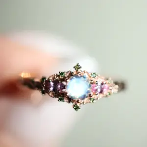 briar rose three stone with 5mm round moonstone and pink sapphire/green diamond accents