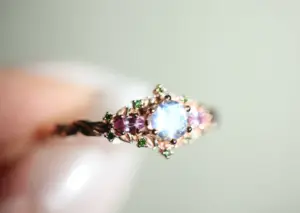 briar rose three stone with 5mm round moonstone and pink sapphire/green diamond accents