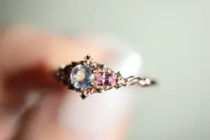 briar rose three stone with 5mm round moonstone and pink sapphire/green diamond accents