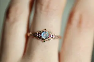 briar rose three stone with 5mm round moonstone and pink sapphire/green diamond accents