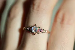 briar rose three stone with 5mm round moonstone and pink sapphire/green diamond accents