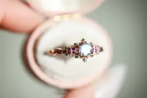 briar rose three stone with 5mm round moonstone and pink sapphire/green diamond accents