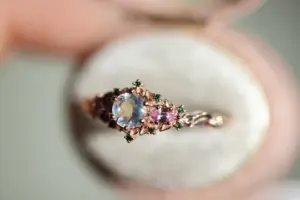 briar rose three stone with 5mm round moonstone and pink sapphire/green diamond accents