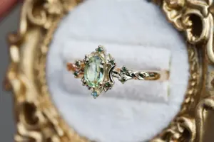 briar rose halo moon with 6x4mm oval lab green sapphire