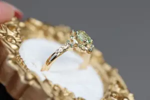 briar rose halo moon with 6x4mm oval lab green sapphire