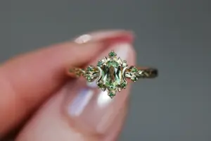 briar rose halo moon with 6x4mm oval lab green sapphire