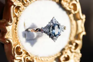 briar rose three stone with marquise accents and 7x5mm grey spinel