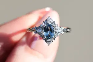 briar rose three stone with marquise accents and 7x5mm grey spinel