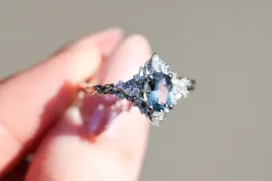 briar rose three stone with marquise accents and 7x5mm grey spinel