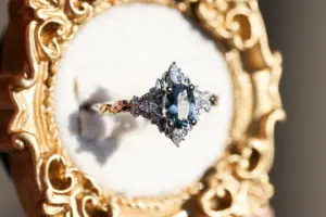 briar rose three stone with marquise accents and 7x5mm grey spinel
