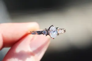 crescent moon three stone with 8x4mm marquise lab diamond