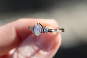 crescent moon three stone with 8x4mm marquise lab diamond