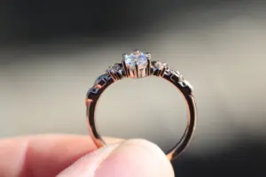 crescent moon three stone with 8x4mm marquise lab diamond