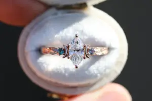 crescent moon three stone with 8x4mm marquise lab diamond