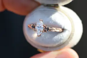 crescent moon three stone with 8x4mm marquise lab diamond