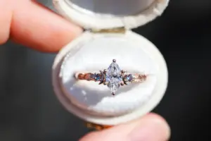 crescent moon three stone with 8x4mm marquise lab diamond