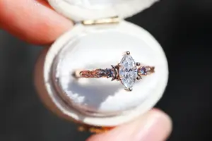 crescent moon three stone with 8x4mm marquise lab diamond