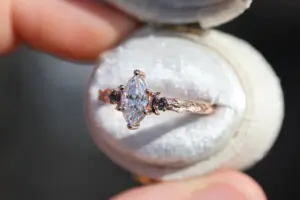 crescent moon three stone with 8x4mm marquise lab diamond