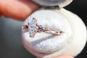 crescent moon three stone with 8x4mm marquise lab diamond