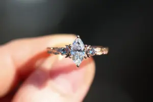 crescent moon three stone with 8x4mm marquise lab diamond