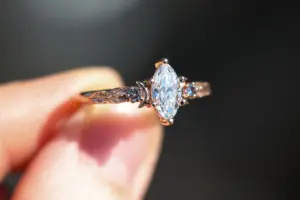crescent moon three stone with 8x4mm marquise lab diamond