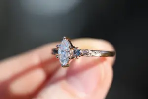 crescent moon three stone with 8x4mm marquise lab diamond