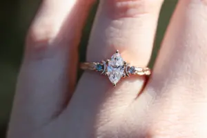 crescent moon three stone with 8x4mm marquise lab diamond