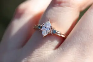 crescent moon three stone with 8x4mm marquise lab diamond