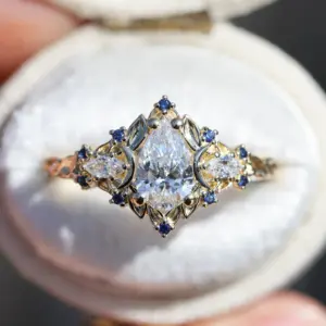 briar moon three stone with 8x5mm pear lab diamond and blue sapphire accents