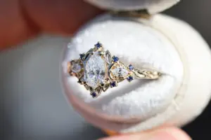 briar moon three stone with 8x5mm pear lab diamond and blue sapphire accents