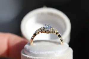 briar moon three stone with 8x5mm pear lab diamond and blue sapphire accents