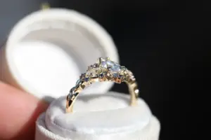 briar moon three stone with 8x5mm pear lab diamond and blue sapphire accents
