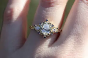 briar moon three stone with 8x5mm pear lab diamond and blue sapphire accents