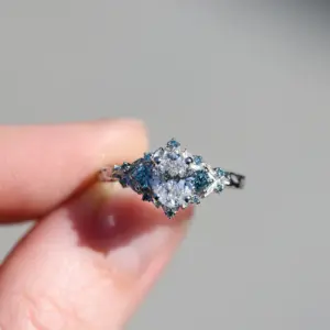 briar rose three stone with .7ct oval lab diamond and aqua diamond
