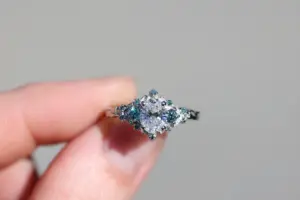 briar rose three stone with .7ct oval lab diamond and aqua diamond