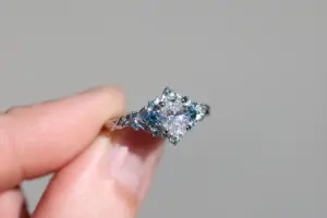 briar rose three stone with .7ct oval lab diamond and aqua diamond