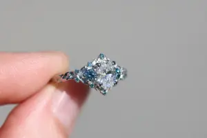 briar rose three stone with .7ct oval lab diamond and aqua diamond