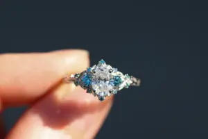 briar rose three stone with .7ct oval lab diamond and aqua diamond