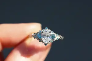 briar rose three stone with .7ct oval lab diamond and aqua diamond